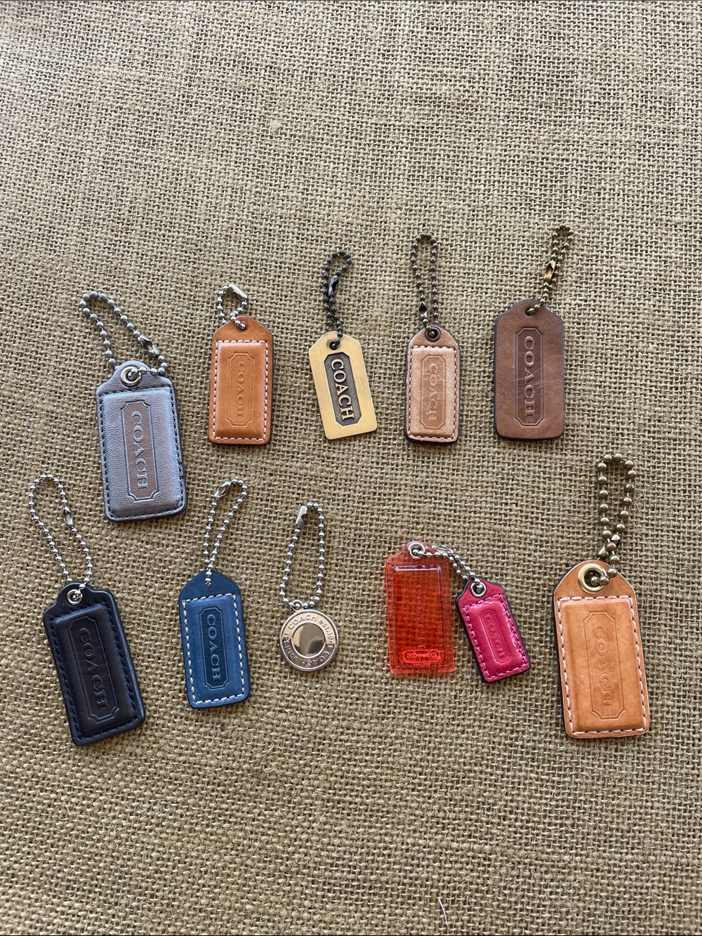 Coach Leather/metal and Acrylic hangtags.Tan, Blue, Pink, Red, metallic silver